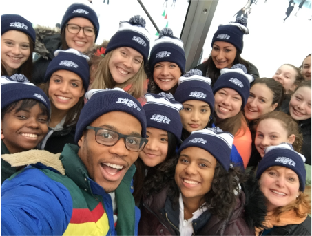 A group of figure skating directors pose for a group photo