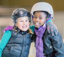 Two young skaters smiling